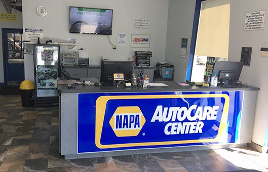 The CK Automotive front desk with its NAPA AutoCare Center sign